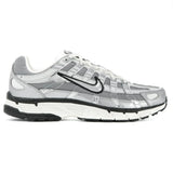 Gray and white athletic shoe with black sole on a white background